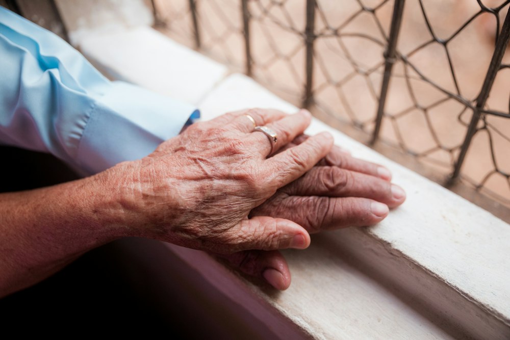 Elderly hands holding each other